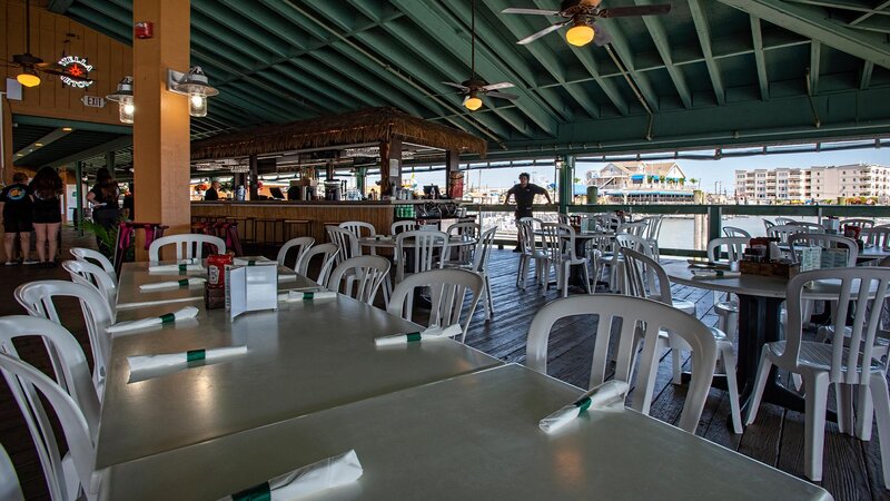 Patio dining area with many set tables