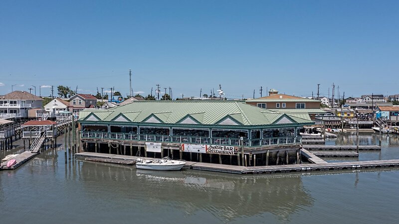 Ariel photo of restaurant with boat docked