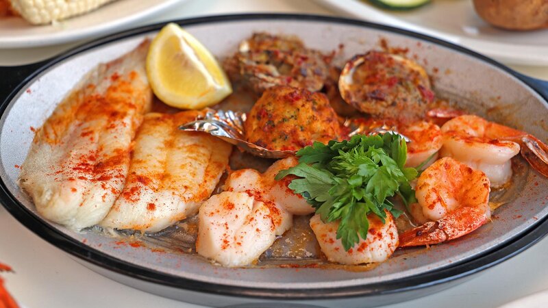 Plated scallops, shrimp and clams