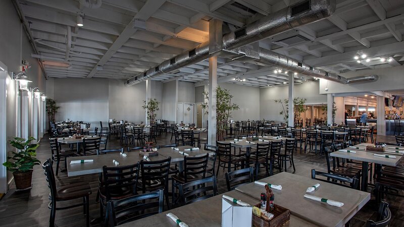 Inside dining area with many set tables