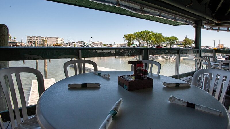 Table set for four with view of the water